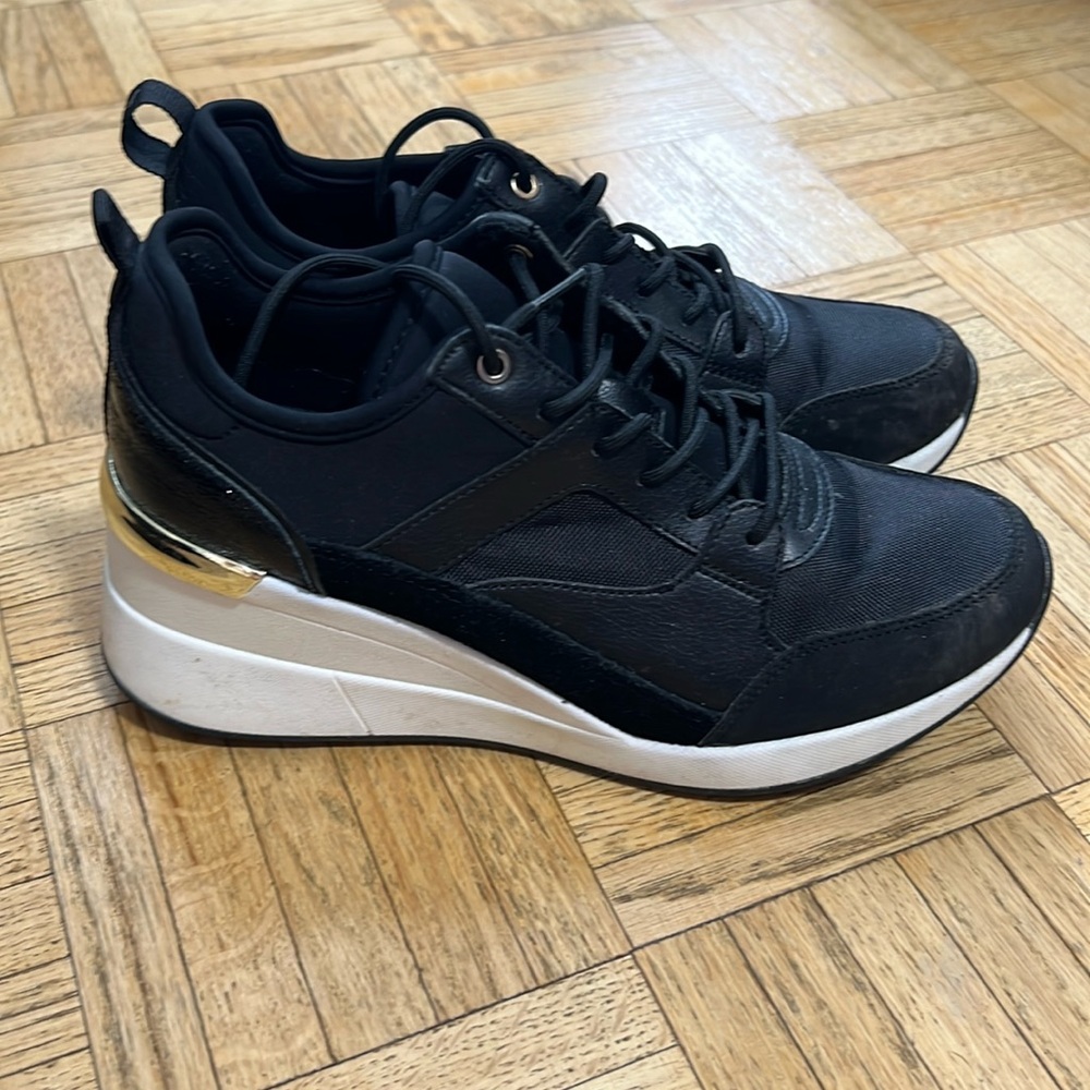 Also sneakers with a wedge for extra height.